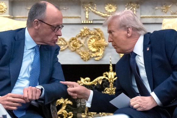 President Donald Trump, right, talks with German Chancellor Friedrich Merz during a meeting in the Oval Office at the White House, Tuesday, March 3, 2026, in Washington. (AP Photo/Mark Schiefelbein)
D ...