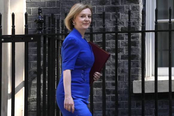 FILE - Britain&#039;s Foreign Secretary Liz Truss arrives for a cabinet meeting at 10 Downing Street in London, Tuesday, June 7, 2022. Two people are running to be Britain���s next prime minister, but ...