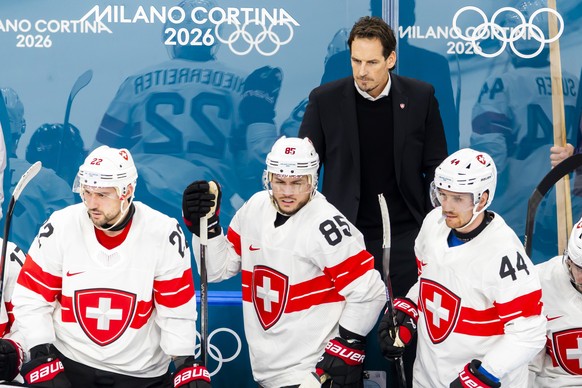 Patrick Fischer, head coach of Switzerland national ice hockey team, observes the game behind Switzerland's Nino Niederreiter #22, Switzerland's Sven Andrighetto #85 and Switzerland's P ...