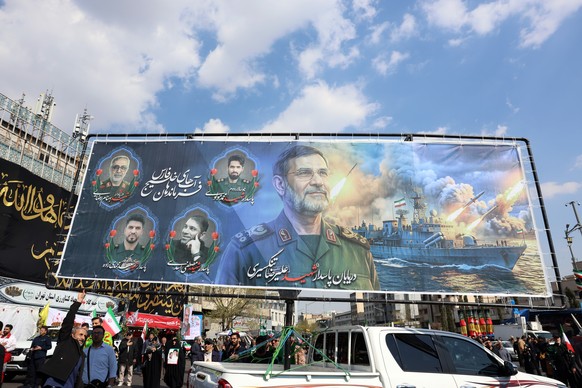 epa12864733 Iranians take part in the funeral for the Islamic Revolutionary Guard Corps (IRGC) Navy Commander Alireza Tangsiri in the Enqelab Square in Tehran, Iran, 01 April 2026. Alireza Tangsiri di ...