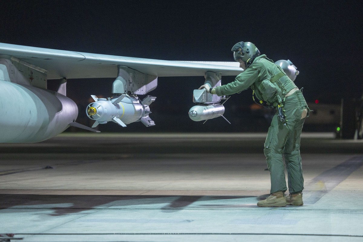 epa12624493 A handout photo made available by the Royal Air Force (RAF) on 03 January 2025 shows a RAF pilot carring out aircraft checks before take off at an undisclosed location in the Middle East.  ...