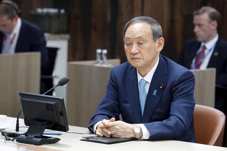 Japanese Prime Minister Yoshihide Suga attends a plenary session, during the G7 summit in Carbis Bay, England, Sunday June 13, 2021. (Phil Noble/Pool via AP)