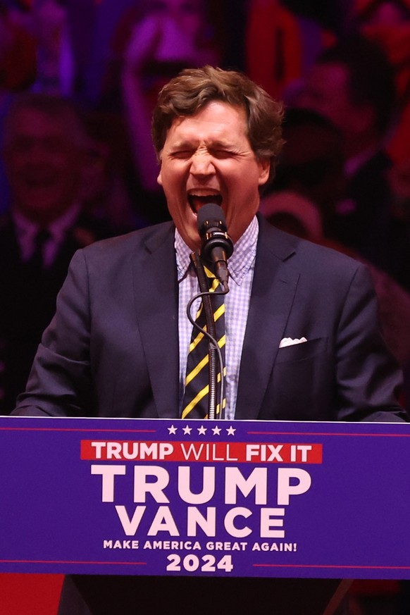 epa11688216 Political commentator Tucker Carlson speaks during a rally held for former US President and Republican presidential candidate Donald Trump, at Madison Square Garden in New York, New York,  ...