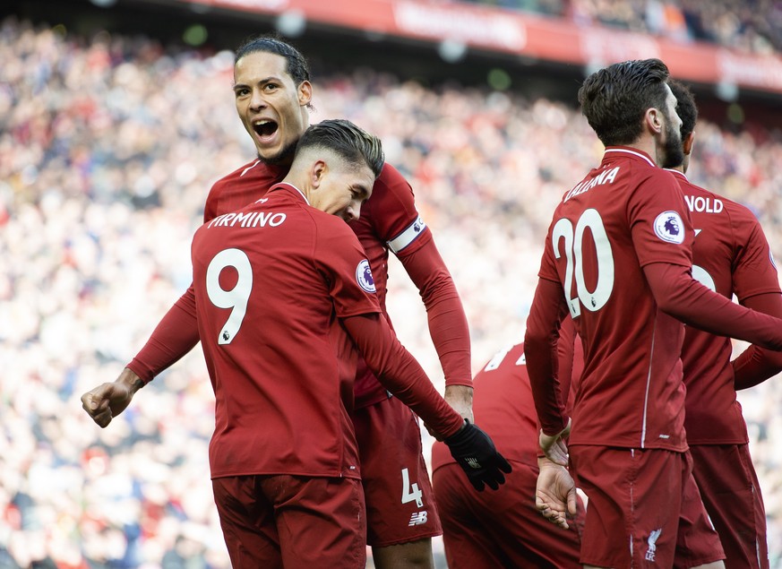 epa07426917 Liverpool&#039;s Roberto Firmino (L) celebrates scoring during the English Premier League soccer match between Liverpool and Burnley held at the Anfield in Liverpool, Britain, 10 March 201 ...