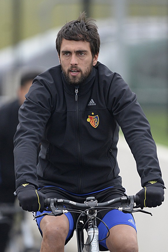 FC Basel&#039;s Matias Emilio Delgado arrives on his bike for a training session in the St. Jakob-Park training area in Basel, Switzerland, on Tuesday, February 17, 2015. Switzerland&#039;s FC Basel 1 ...