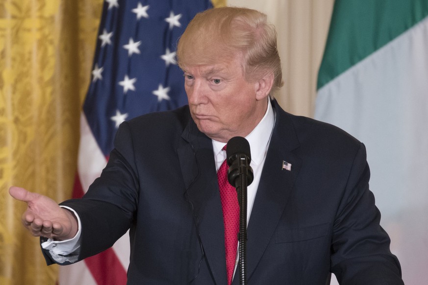 epa05918075 US President Donald J. Trump gestures during a joint press conference with Prime Minister of Italy Paolo Gentiloni (not pictured) in the East Room of the White House in Washington, DC, USA ...