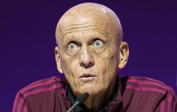 Chairman of the FIFA referees committee Pierluigi Collina , center, talks to the media at a press conference of the FIFA referees at the World Cup media center in Doha, Qatar, Friday, Nov. 18, 2022.(A ...