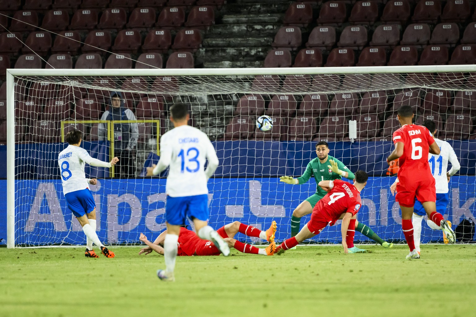 France&#039;s Maxence Caqueret, left, scores a goal against Switzerland&#039;s goalkeeper Amir Saipi, right, during a Group D match between Switzerland and France at the 2023 UEFA European Under-21 Ch ...