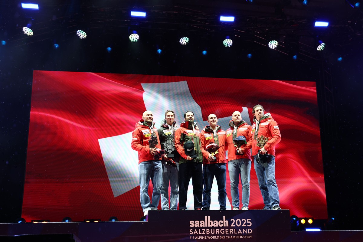 epa11891381 Silver medalists Alexis Monney and Tanguy Nef of Switzerland, gold medalists Loic Meillard and Franjo von Allmen of Switzerland and bronze medalists Stefan Rogentin and Marc Rochat of Swit ...