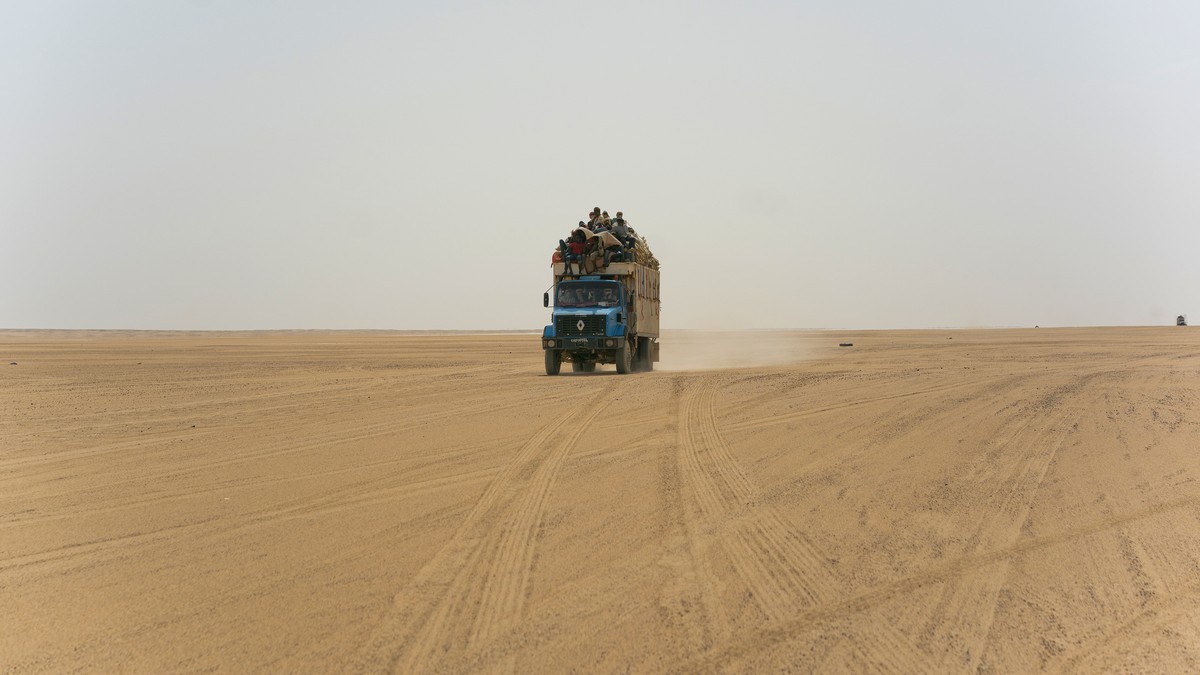 A truck carrying goods and migrants drives through Niger's Tenere desert region of the south central Sahara on Sunday, June 3, 2018. Once a well-worn roadway for overlander tourists, the highway’ ...