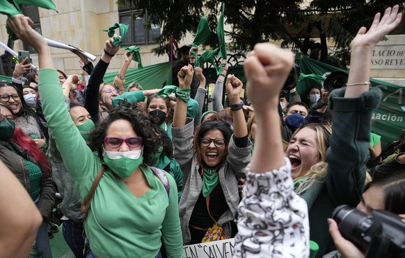 Abortion-rights activists celebrate after the Constitutional Court approved the decriminalization of abortion, lifting all limitations on the procedure until the 24th week of pregnancy, in Bogota, Col ...