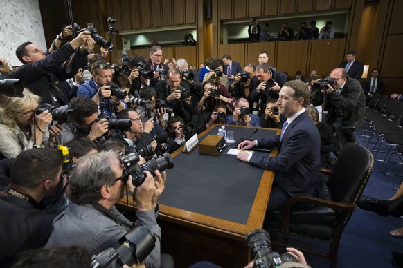 epa06660104 CEO of Facebook Mark Zuckerberg (R) takes his seat to testify before the Senate Commerce, Science and Transportation Committee and the Senate Judiciary Committee joint hearing on &#039;Fac ...