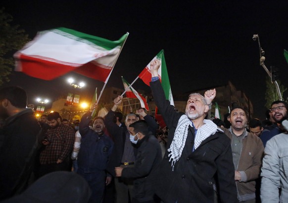 epa11277469 Iranians celebrate after Iran launched drone attacks against Israel; in front of the British embassy in Tehran, Iran, 14 April 2024. Iran&#039;s Islamic Revolutionary Guards Corps (IRGC) l ...