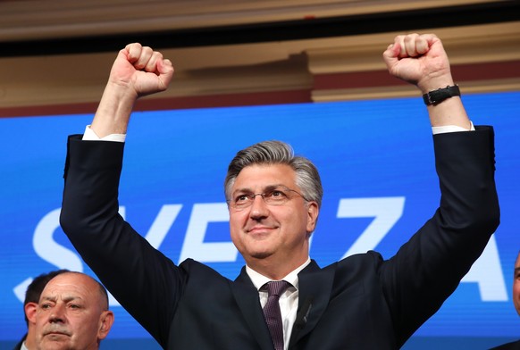 epa11285651 Croatian Prime Minister Andrej Plenkovic from the Croatian Democratic Union (HDZ) reacts to his victory during the Parliamentary elections, at their head quaters in Zagreb, Croatia, 17 Apr ...