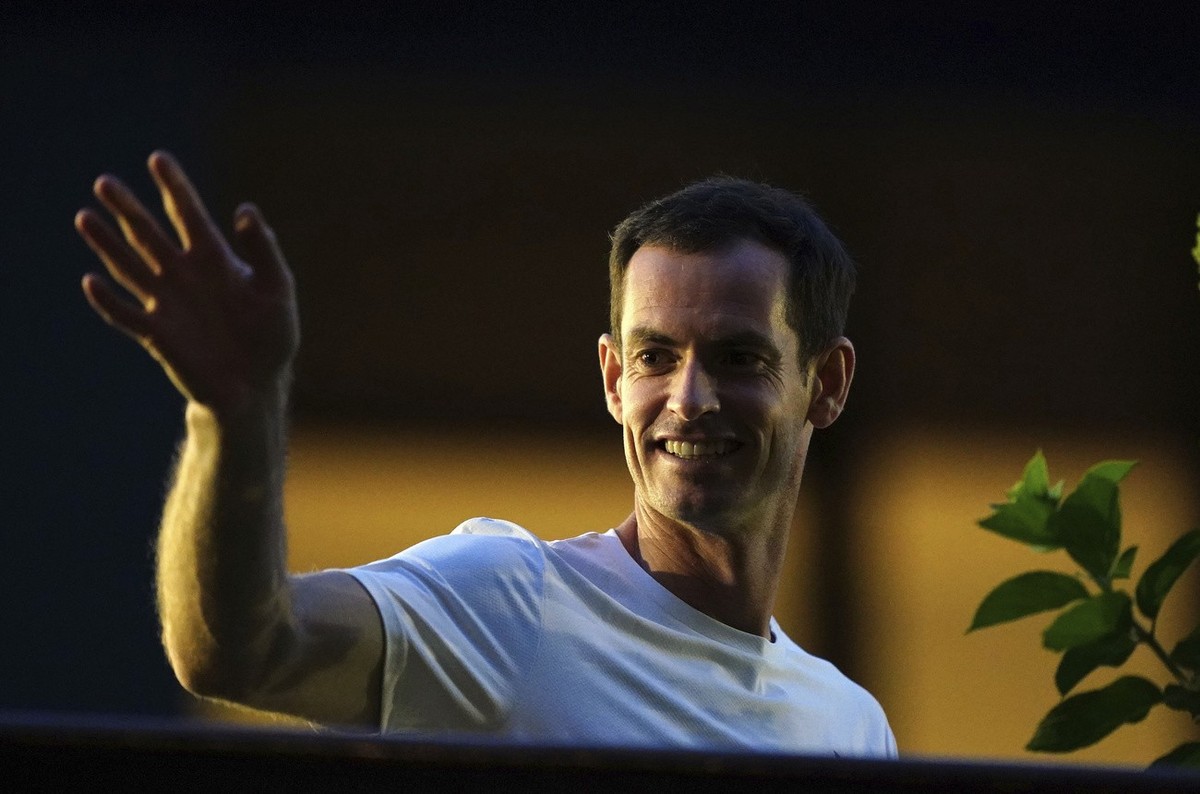 Britain's Andy Murray waves as he leaves Center Court following his first round doubles loss at the Wimbledon tennis championships in London, Thursday, July 4, 2024. (Zac Goodwin/PA via AP)