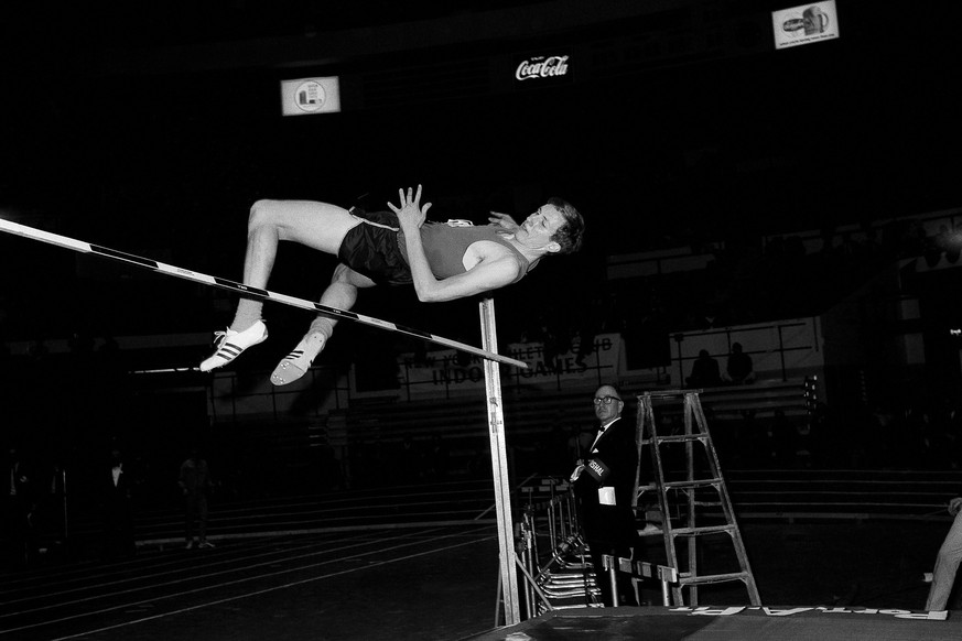 Dick Fosbury of Oregon State tries a seven foot two inch high jump with his head first style in the New York Athletic club track meet at Madison Square Garden in New York, Feb. 17, 1968. Fosbury, the  ...