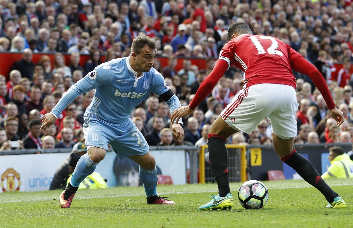 Britain Soccer Football - Manchester United v Stoke City - Premier League - Old Trafford - 2/10/16
Manchester United's Chris Smalling in action with Stoke City's Xherdan Shaqiri 
Action Im ...