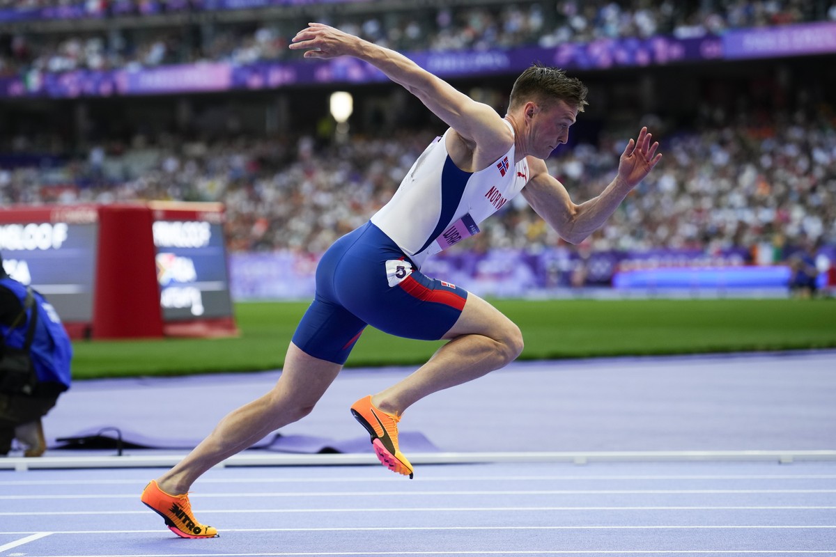 Karsten Warholm, of Norway, competes in the men's 400-meter hurdles heat at the 2024 Summer Olympics, Monday, Aug. 5, 2024, in Saint-Denis, France. (AP Photo/Petr David Josek)