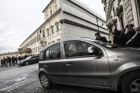 New Italian President Sergio Mattarella arrives at the Constitutional court building near the Quirinal Palace, the official residence of the President of the Italian Republic, background, in Rome, Jan ...