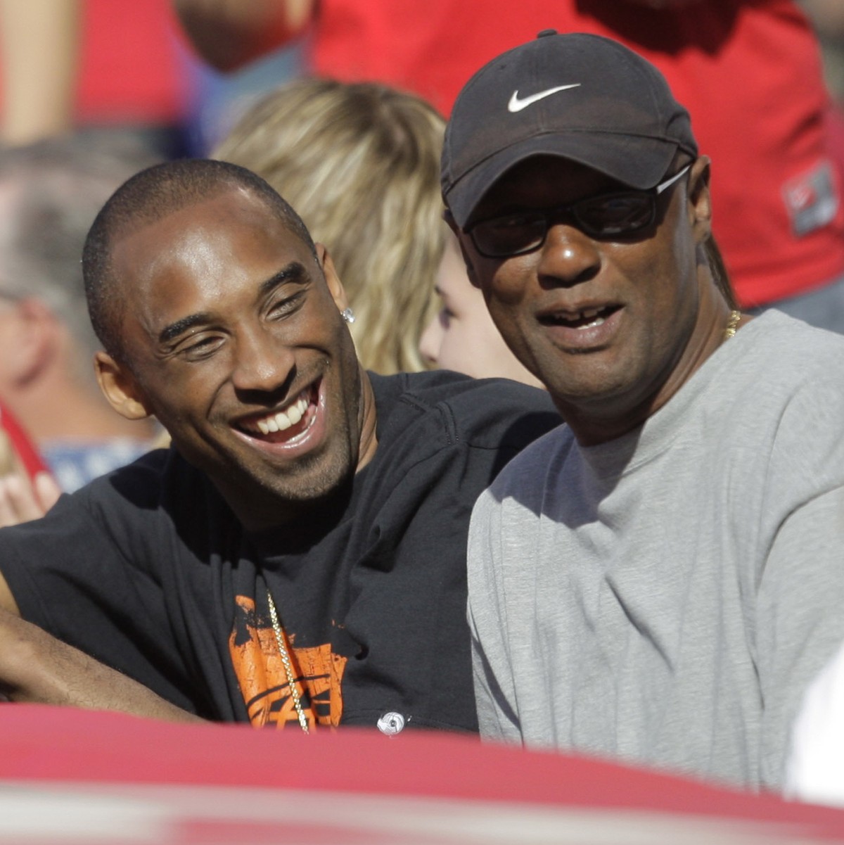 FILE - Los Angeles Lakers' Kobe Bryant, left, talks to his father, Joe, as they watch a baseball game between the Los Angeles Angels and the Los Angeles Dodgers in Anaheim, Calif., Sunday, June 2 ...