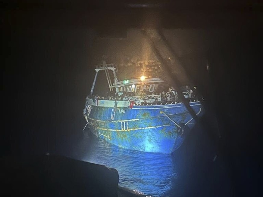 FILE - This undated handout image, provided by the Hellenic Coast Guard on Wednesday, June 14, 2023, shows dozens of people on a battered fishing boat that later capsized and sank off the coast of southern Greece.  ...