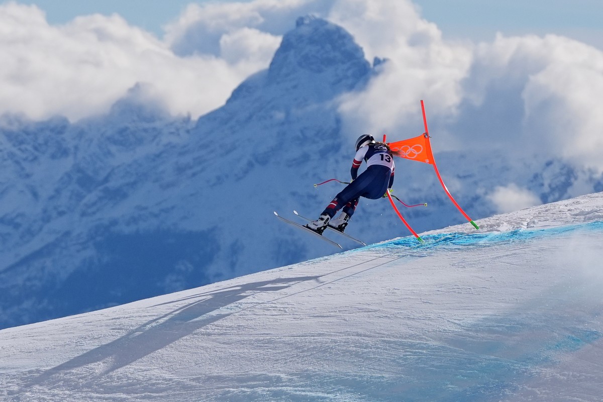 FILE - United States' Lindsey Vonn crashes into a gate during an alpine skiing women's downhill race, at the 2026 Winter Olympics, in Cortina d'Ampezzo, Italy, Feb. 8, 2026. (AP Photo/J ...