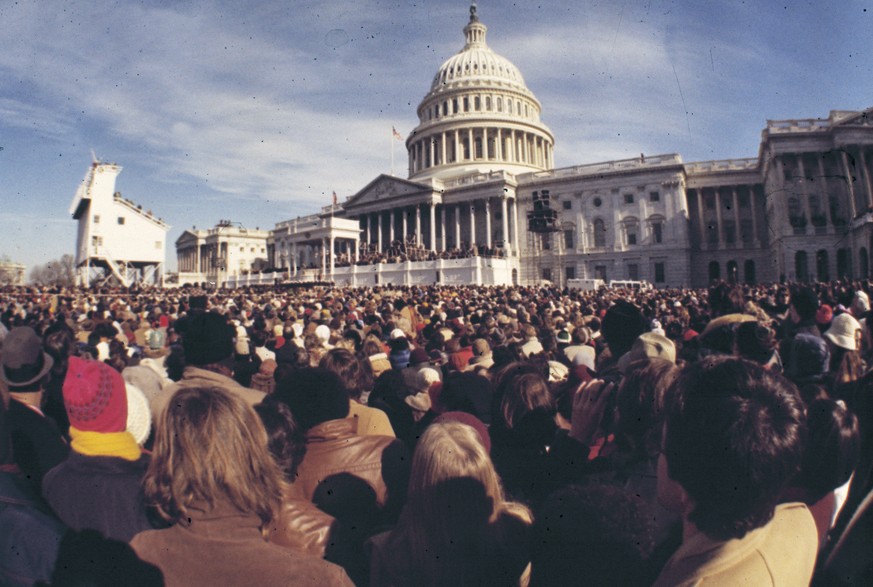FILE - Attendees gathers outside the U.S. Capitol for the inauguration of President-elect Jimmy Carter as he is sworn in as the 39th president of the United States in Washington, Jan. 20, 1977. (AP Ph ...