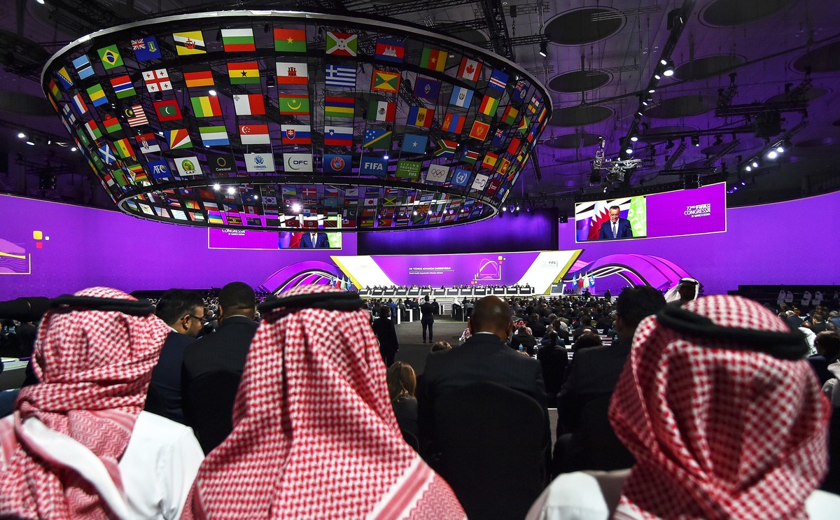epa09861610 Attendees listen to the speech of Director-General of the World Health Organization Tedros Adhanom Ghebreyesus during the 72nd FIFA Congress in Doha, Qatar, 31 March 2022. EPA/NOUSHAD THEK ...