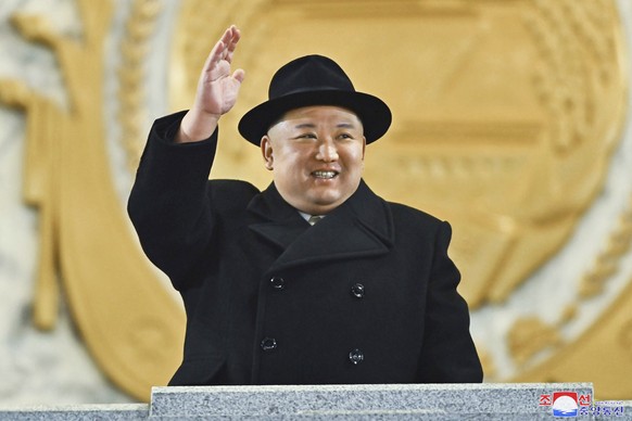 In this photo provided by the North Korean government, North Korean leader Kim Jong-un waves his hand as he watches a military parade in Kim Il Sung Square in Pyongyang, North Korea, Wednesday, Feb. 2 .