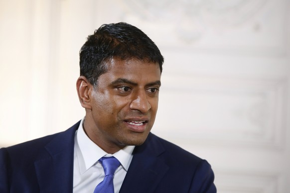 epa06465808 Global Head Drug Development and Chief Medical of Swiss multinational pharmaceutical company Novartis, Vasant Narasimhan, attends a meeting with French President Emmanuel Macron, during th ...