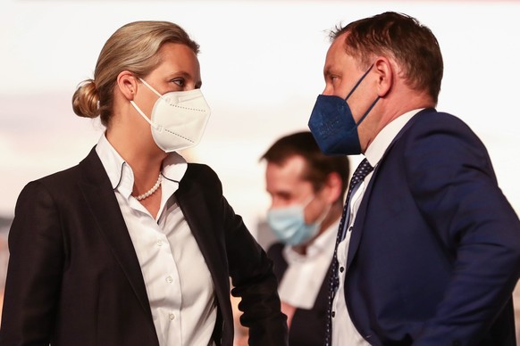 epa09126018 Alternative for Germany party (AfD) co-chairman Tino Chrupalla (R) talks to Alternative for Germany party (AfD) faction co-chairwoman in the German parliament Bundestag and deputy chairwom ...