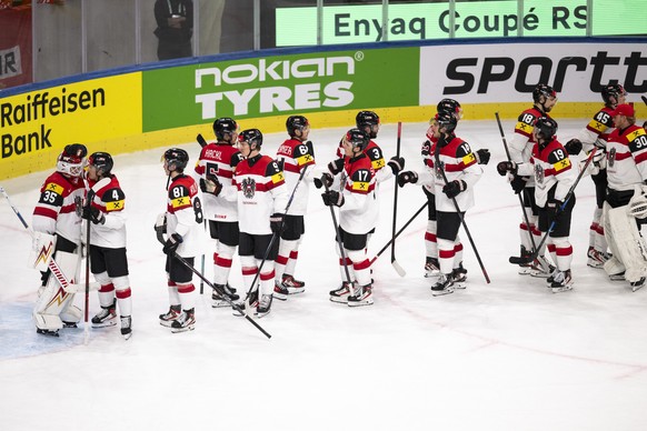 Austria's players reacts after the defeat during the 2026 IIHF Men's Ice Hockey World Championship preliminary round group A game between United States and Austria, at the Swiss Life Arena i ...