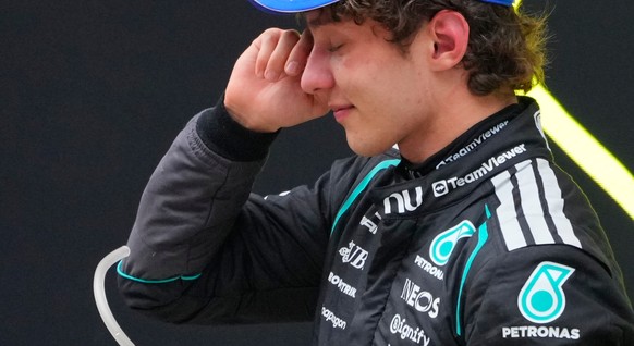 Mercedes driver Andrea Kimi Antonelli of Italy reacts on the podium after he clocked the fastest time to win the Chinese Formula One Grand Prix race at the Shanghai International Circuit, in Shanghai, ...