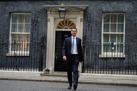 Jeremy Hunt leaves 10 Downing Street in London after he was appointed Chancellor of the Exchequer following the resignation of Kwasi Kwarteng, Friday Oct. 14, 2022. Chancellor of the Exchequer Kwasi K ...