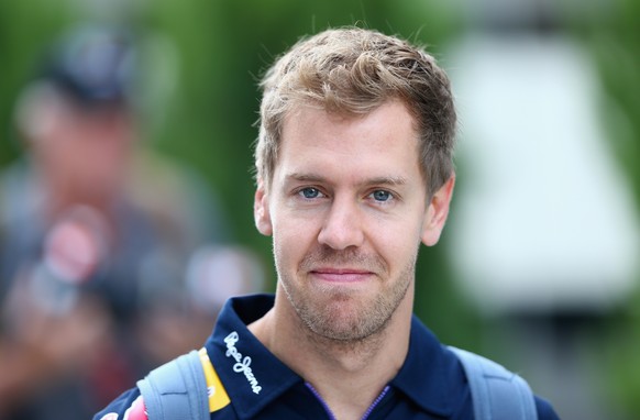 SOCHI, RUSSIA - OCTOBER 12: Sebastian Vettel of Germany and Infiniti Red Bull Racing arrives in the paddock for the Russian Formula One Grand Prix at Sochi Autodrom on October 12, 2014 in Sochi, Russi ...