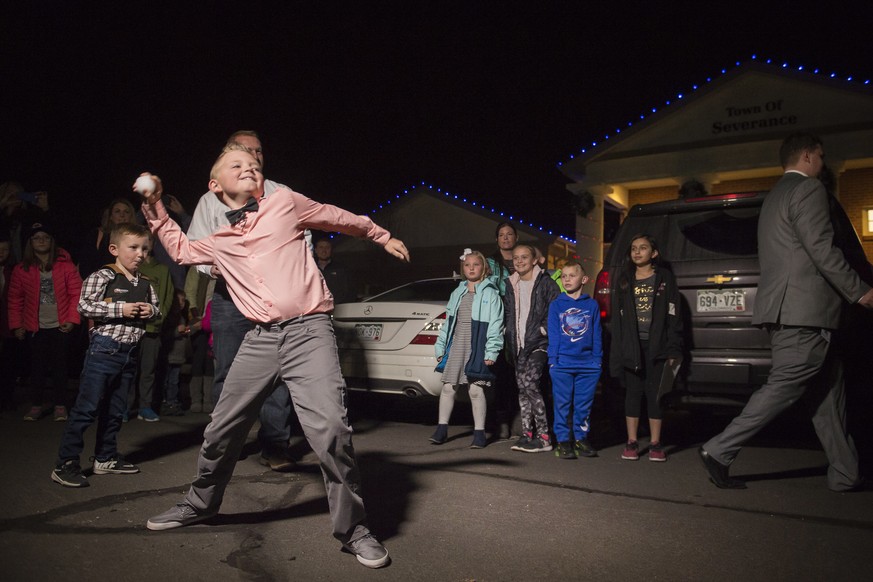 Range View Elementary School third grader Dane Best throws the first legal snowball in the parking lot of the Town Hall after presenting his argument to the town board trustees to change a law in Seve ...