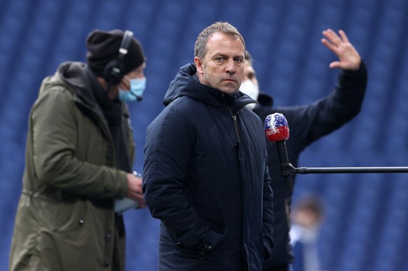 epa08962151 Hans-Dieter Flick, coach of Bayern Munich, looks on prior to the German Bundesliga soccer match between FC Schalke 04 and FC Bayern Munich at Veltins-Arena in Gelsenkirchen, Germany, 24 Ja ...