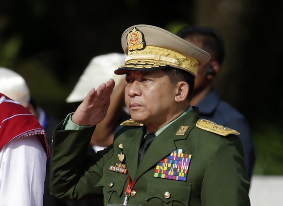 epa07726014 Myanmar military commander-in-chief Senior General Min Aung Hlaing pays homage to the late General Aung San, along with other leaders of the pre-independence Myanmar government, during a c ...