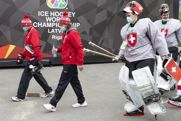 epa09215190 Tommy Albelin (L), assistant coach of Switzerland national ice hockey team, Patrick Fischer (2nd L), head coach of Switzerland national ice hockey team, Switzerland&#039;s goaltenders Leon ...