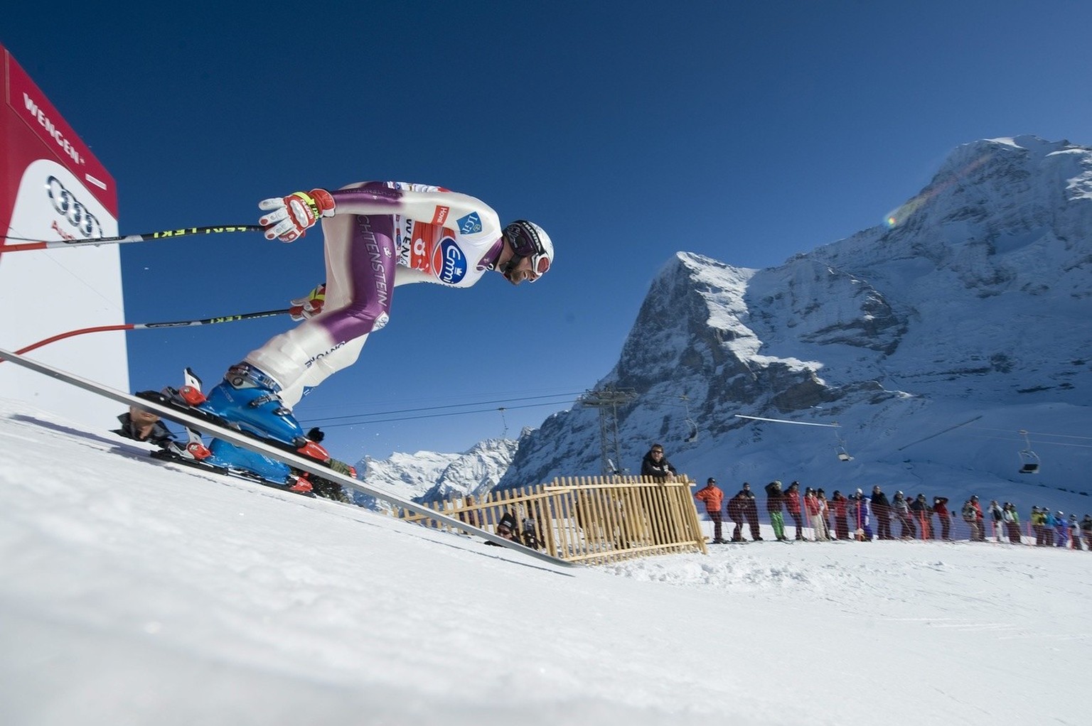 Liechtenstein&#039;s ski racer Marco Buechel during the first downhill training at the FIS Ski World Cup at the Lauberhorn in Wengen, Switzerland, Tuesday, January 12, 2010. In the background, centre, ...