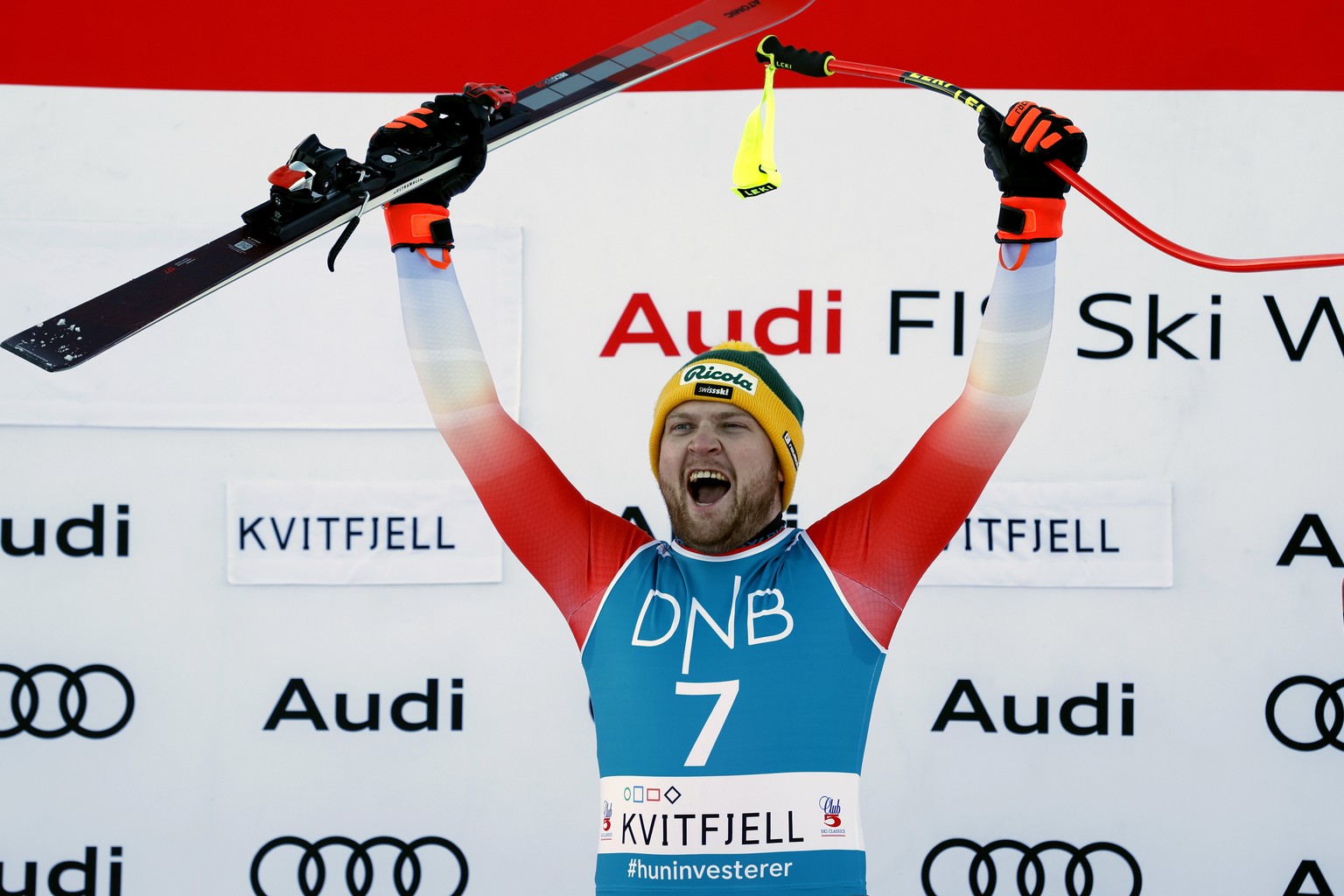 Switzerland&#039;s Niels Hintermann celebrates on the podium after winning an alpine ski, men&#039;s World Cup downhill race, in Kvitfjell, Norway, Saturday, Feb. 17, 2024. (AP Photo/Alessandro Trovat ...