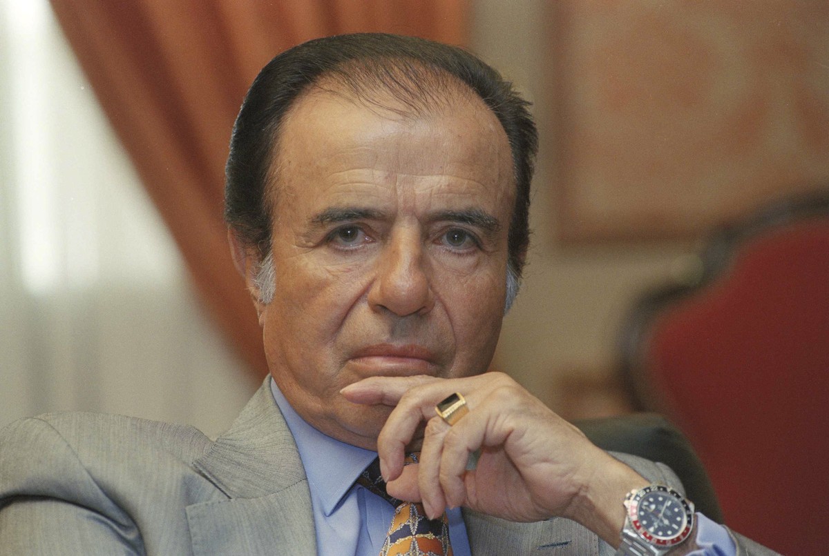 FILE - In this Oct. 28, 1997 file photo, Argentina's President Carlos Menem Talks to reporters in Buenos Aires, Argentina. Argentine President Alberto Fernández has confirmed on Sunday, Feb. 14,  ...