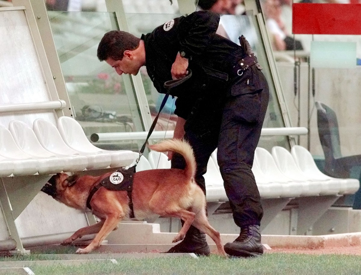A police dog checks the Iranian bench searching for explosives, Sunday, June 21, 1998, before the USA v Iran, Group F, World Cup match at Gerland Stadium. Other teams in Group F are Germany and Yugosl ...