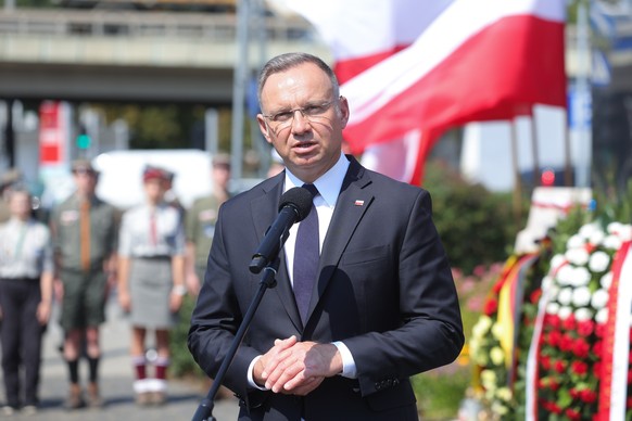 epa11514639 Polish President Andrzej Duda speaks during a wreath laying ceremony at the Monument to the Victims of the Wola Massacre, during the 80th anniversary of Warsaw Uprising in Warsaw, Poland,  ...