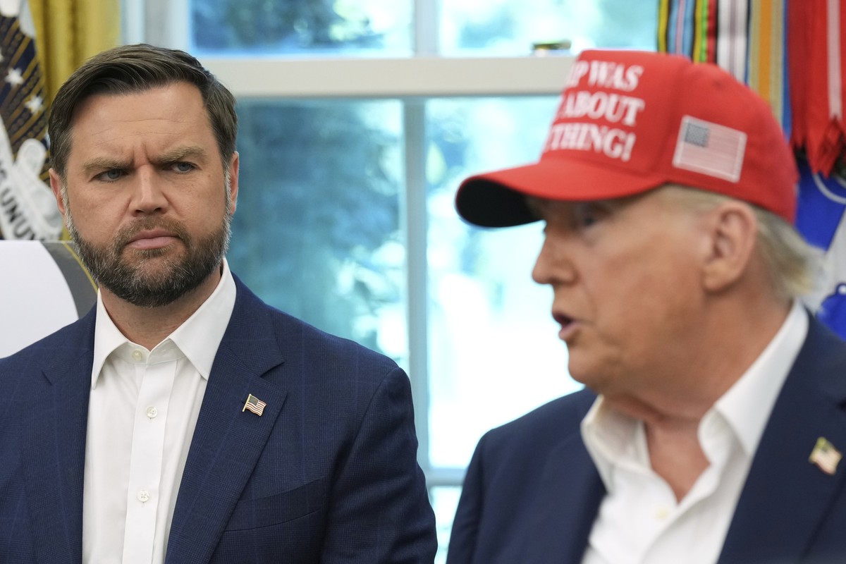 Vice President JD Vance looks on as President Donald Trump speaks in the Oval Office of the White House, Friday, Aug. 22, 2025, in Washington. (AP Photo/Jacquelyn Martin)
Donald Trump