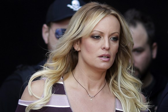 FILE - Adult film actress Stormy Daniels arrives for the opening of the adult entertainment fair Venus in Berlin, Oct. 11, 2018. A lawyer for Donald Trump said Thursday, March 30, 2023, that he has be ...