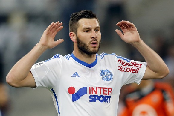 Olympique Marseille&#039;s Pierre-Andre Gignac reacts after missing a scoring opportunity during their French Ligue 1 soccer match against Lorient at the Velodrome stadium in Marseille, France, April  ...