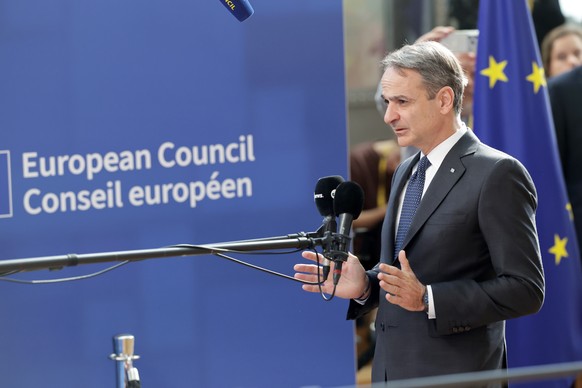 epa12832398 Greek Prime Minister Kyriakos Mitsotakis arrives for a formal meeting of the European Council in Brussels, Belgium, 19 March 2026. Leaders are expected to discuss the situation in the Midd ...
