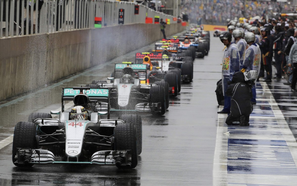 Formula One - F1 - Brazilian Grand Prix - Circuit of Interlagos, Sao Paulo, Brazil - 13/11/2016 - Mercedes' Lewis Hamilton of Britain (44) leads other cars in the pit area during a pause in racin ...