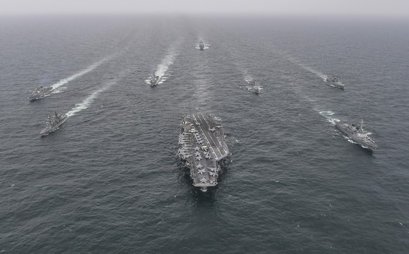 FILE - In this photo provided by the South Korea Defense Ministry, South Korean Navy&#039;s destroyer Yulgok Yi I, front row right, U.S. Navy&#039;s aircraft carrier USS Nimitz, center, Japan Maritime ...